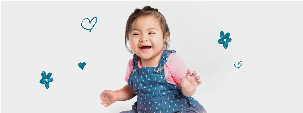 Young girl with special needs sitting and smiling at the camera